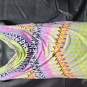 Calvin Klein size XL Is sleeveless blouse with asymmetrical Patterns.